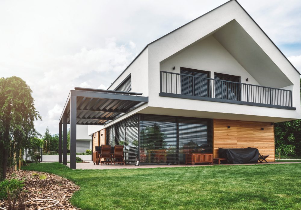 Modern house with garden and patio area.